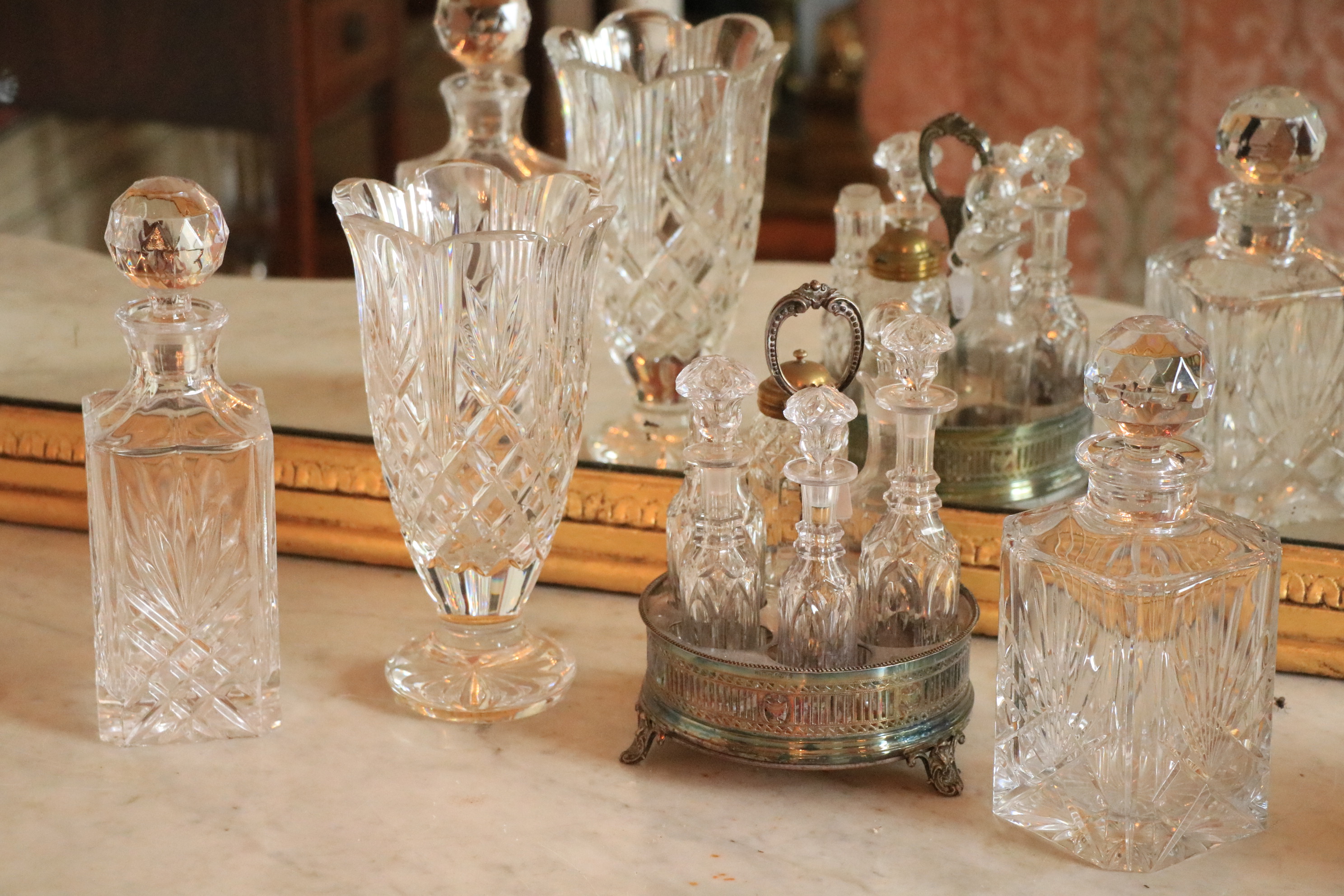 A Waterford crystal Vase, 10'' (25cms), together with two similar square glass Decanters and a