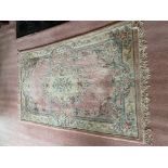 Two similar Chinese wool Rugs, each with pink and floral ground, 100'' x 60'' (254cms x 152cms)