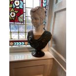 A heavy three colour carved marble Bust, of a Lady on circular base, 25'' (63cms). (1)