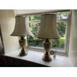 An attractive pair of faux marble and brass Table Lamps, with ivory shades, 30'' (76cms). (2)