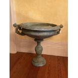 A heavy green patinated bronzed two handled Garden Urn, with scroll handles on vase shaped stem on