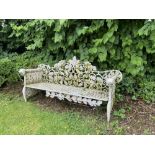 A pair of heavy cast iron Garden Benches, each rustic open work back with scrolling oak leaves above