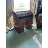 An Edwardian walnut pedestal cylinder Desk, with tambour front on two pedestals each with three