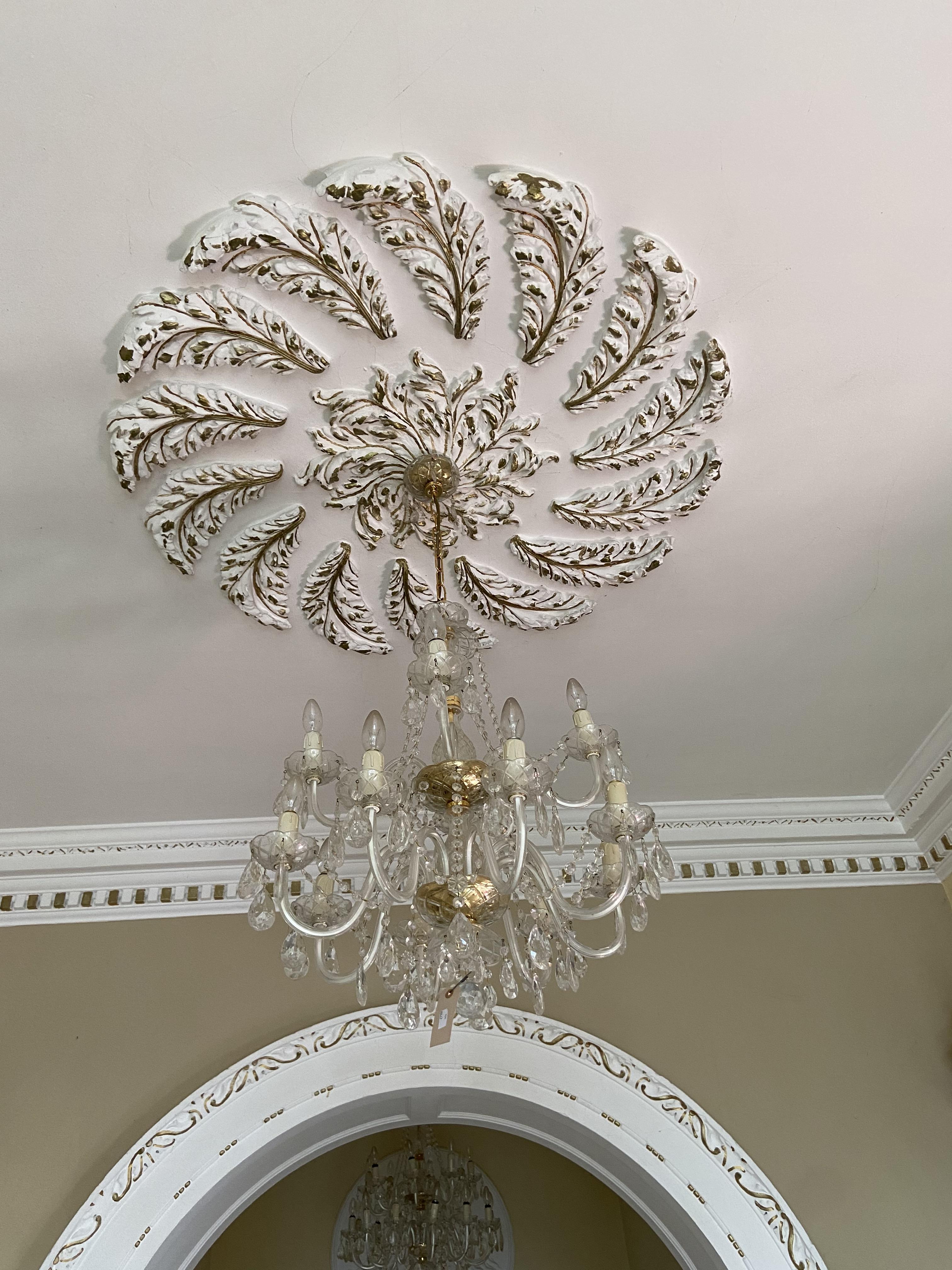 An attractive glass Chandelier, with 12 arms on two levels with festoons of buttons and drops,