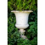 A massive pair of heavy compana shaped cast iron Garden Urns, each with a reeded rim and half reeded