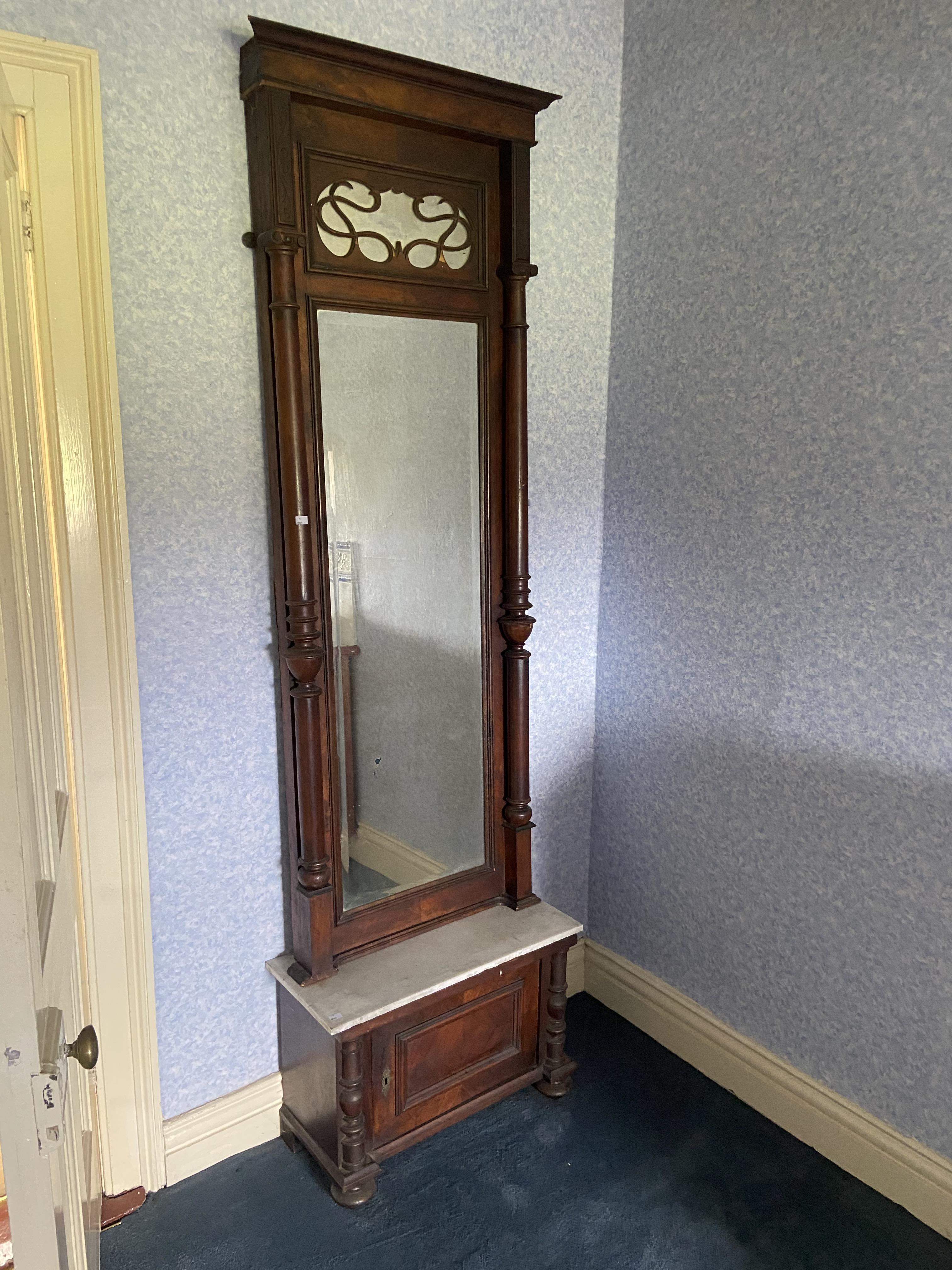 A 19th Century walnut Pier Mirror, with moulded cornice above a bevelled plate flanked with two