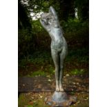 A fine bronze Garden Figure, life size, modelled as a Nude Girl with arms crossed behind her head