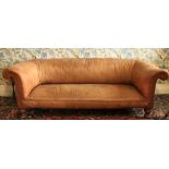 A late Victorian walnut Chesterfield Settee, in the Gothic Revival taste, covered in tan hide on