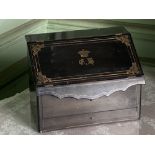A brass inlaid ebonised slope front Stationary Box, with inlaid brass coronet and monogram, 12" (