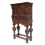 An attractive 19th Century heavily carved Cupboard on Stand, in the Renaissance style, with double