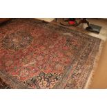 A large antique PersianÿCarpet, with all over floral pattern and centre medallion panel of dark blue