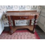 A George IV period mahogany Side Table, with rectangular top and frieze drawer, on ring turned legs,