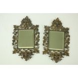 A matching pair of heavy attractive cast brass Wall Mirrors, each with bevelled plate, inside a
