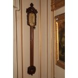 A quality Victorian oak framed Stick Barometer, with arched and pierced capital, by J. Hicks, 8, 9 &