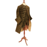 A late 18th Century silk brocade brown Gentleman's Coat, with all over floral pattern, two side