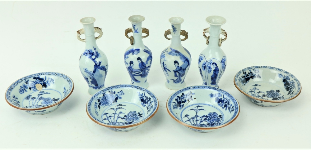 A set of 4 small Chinese porcelain Vases, each decorated with figures, under two dragon mask