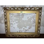 A rectangular Florentine carved giltwood Frame, with scrolling foliage, to fit canvas 22" x 28" (