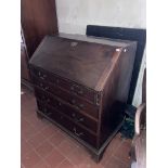 A George III period mahogany slope front Bureau, with fitted interior and four long graduating