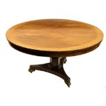 A Regency period rosewood inlaid and crossbanded Breakfast Table, with circular flip top raised on a