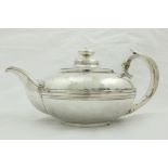 A George IV Irish silver Teapot, by William Nowlan, Dublin 1826, of circular form with scroll handle