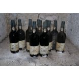 Twelve Bottles of Taylors 1985 Vintage Port, (imported by Woodforde Bourne), labels worn and damp