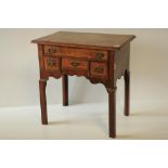 An 18th Century walnut Lowboy, the crossbanded top with herringbone inlay over single frieze drawer,