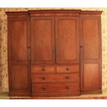 A fine William IV period Irish mahogany Breakfront Wardrobe Chest, with a rope moulded reeded