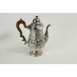 A large George IV Irish baluster shaped crested silver Coffee Pot, by James Le Bas, Dublin 1829-