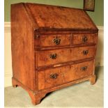 A very fine George II period walnut slope frontÿBureau, the finely figured crossbanded top and