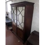 A 19th Century inlaid mahogany Wardrobe, with moulded cornice above two astragal glazed doors with
