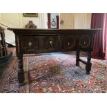 An 18th Century Jacobean style oak Side Table, the plain top over two frieze drawers decorated
