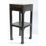 A good Japanese two tier square Jardinière Table, in black lacquer and parcel gilt decorated with