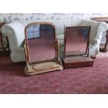 A Victorian satin birch swing frame Dressing Table, with arched plate on shaped supports and