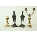 A pair of Regency bronze and gilt bronze Candlesticks, each with an urn socket above hanging vine