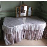 A modern kidney shaped wooden Dressing Table, with glass top, and lace drapes, approx. 63" (160cms);