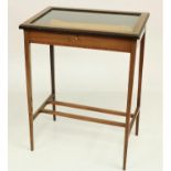 A rectangular mahogany and kingwood banded Curio Display Table, with glazed and hinged top on square