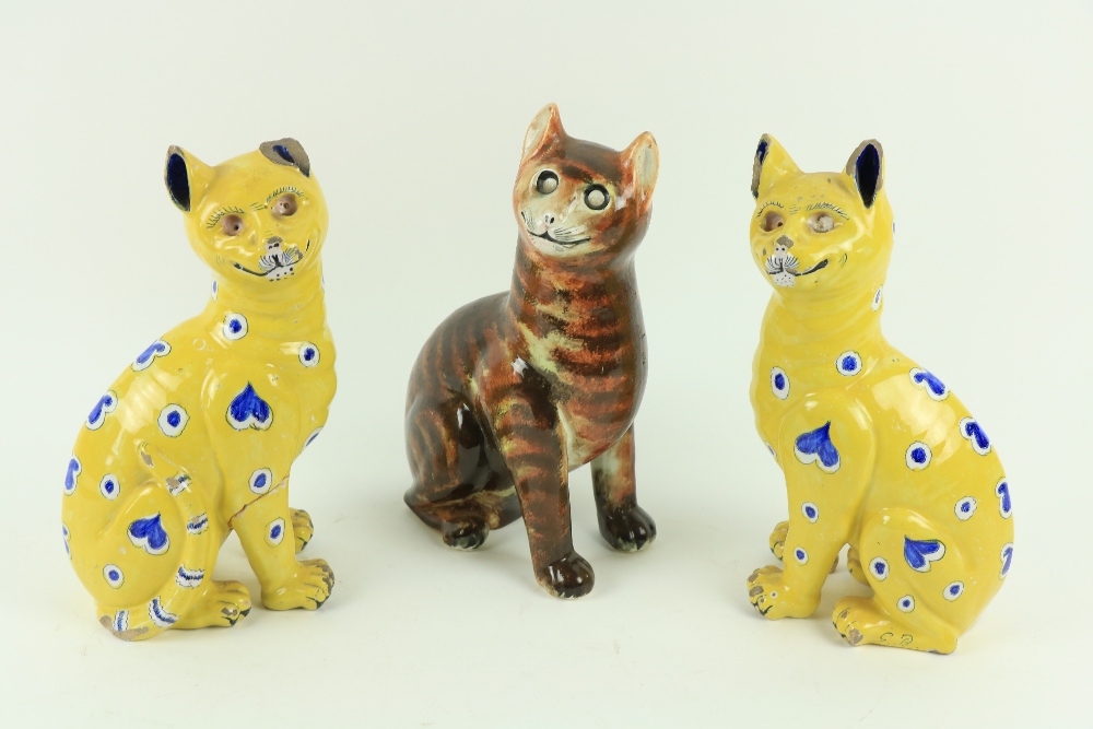 A pair of mile Gall‚ Smiling Cat Figures, in yellow glazed faience, c. 1890, each approx. 13" (