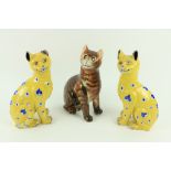 A pair of mile Gall‚ Smiling Cat Figures, in yellow glazed faience, c. 1890, each approx. 13" (