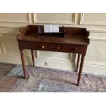 A William IV period mahoganyÿDressing Table, with three-quarter gallery above two frieze drawers