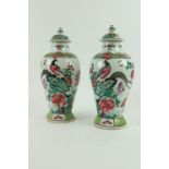 A pair of attractive 19th Century Chinese porcelain Vases and Covers, of bulbous form decorated with