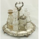 A heavy crested silver plated Cruet Stand, with an arrangement of associated bottles and a jar. (1)