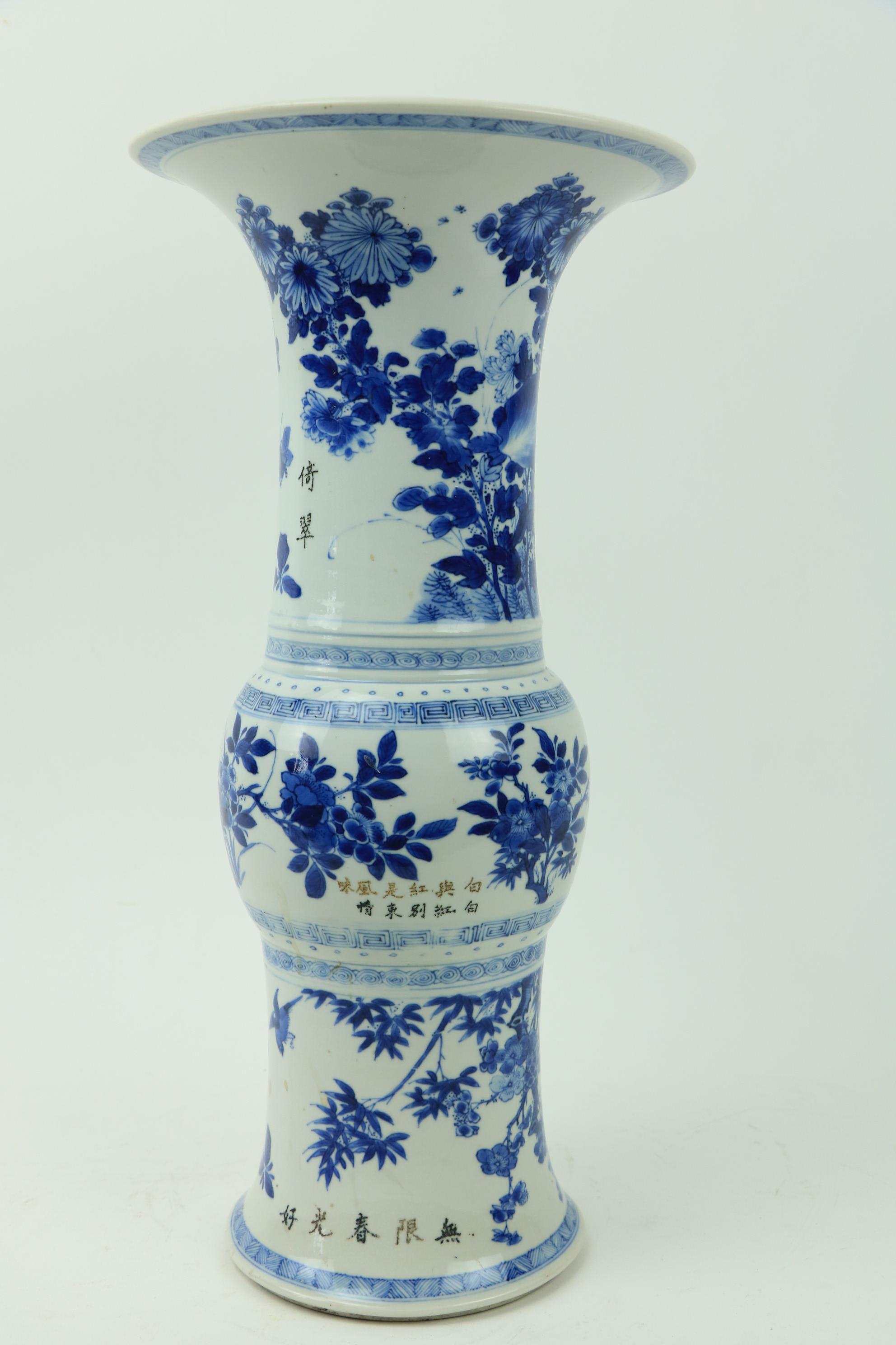 A large important Kangxi period blue and white Gu Vase, 18th Century, decorated with birds and