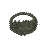 A rare 19th Century Irish carved bog oak Brooch, with view of Howth Castle, in a carved oval wreath,