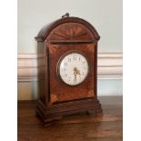 An attractive 19th Century walnut and inlaid Mantel Clock, the arched top with sunburst design