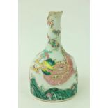 An 18th Century Chinese Famille Verte Bottle Vase, with four claw dragon, in relief, over jumping