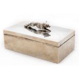 A rectangular silver Cigarette Box, the hinged top surmounted with the figure of a running fox,