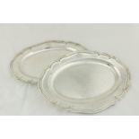 A good pair of oval silver plated and crested Serving Platters, 19th Century, 14 1/4" (36cms). (2)