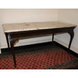 A walnut Side Table, 18th Century and later, probably Irish, with white veined marble top raised