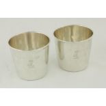 A pair of plain George III Irish crested silver Beakers, by Richard Whilford, Dublin 1815, each 3