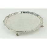 A small late Victorian silver Salver, London 1895, of circular serpentine form with bead edge on